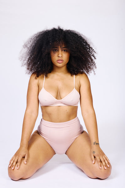 Woman wearing blush PRISM underwear Woman wearing blush PRISM underwear