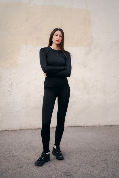 Woman wearing black PRISM Activewear Woman wearing black PRISM Activewear