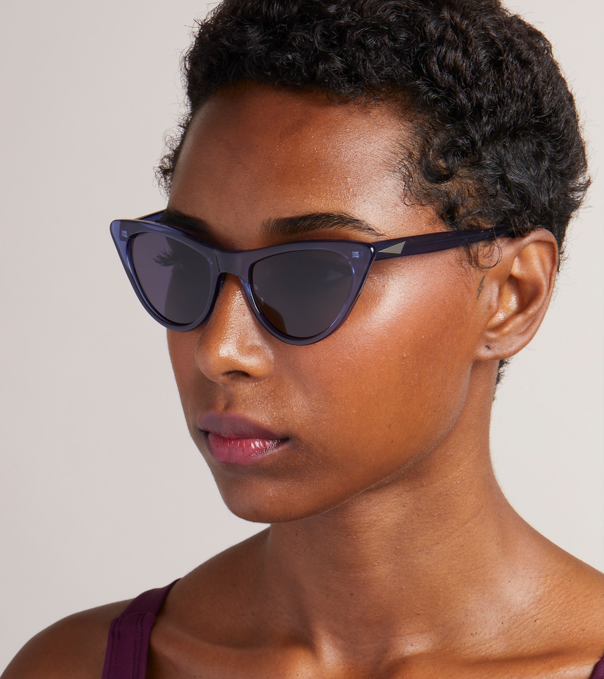 Woman wearing black PRISM sunglasses