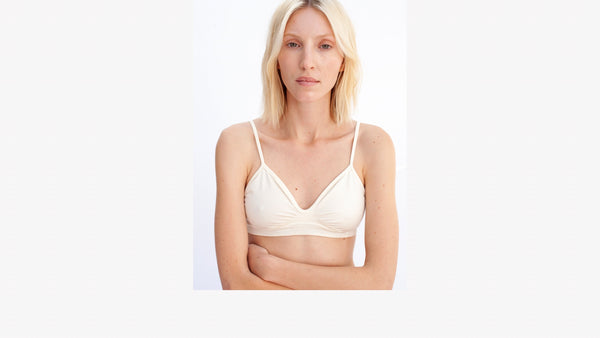 model wearing prism squared liberated bra in cream 