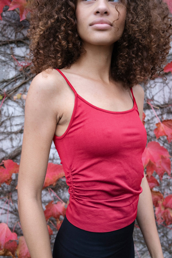 model shot wearing harmonious top in fuchsia