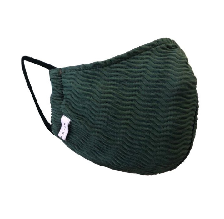 KIDS MASK - Green Waves. Masks handmade in Italy using excess swimwear material, for sustainability. All fabric is breathable and water resistant. Every mask has its own unique design and fabric. Protect yourself, your loved ones, and the environment. This fabric is a lightweight, traditional swim fabric.