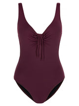 SHELTER ISLAND - Wine. This is a simple yet sexy one-piece swimsuit. With a high cut leg, scoop neckline featuring adjustable gathered detail with tie and thin shoulder straps. The back of the body scoops low with gathered detail with tie and the centre back to match the front. This lightweight, matte swim fabric is fully lined.