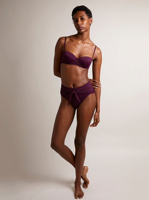 POSITANO in Wine - Inspired by 1960s vintage swimwear, this structured bikini top in navy is designed with a bandeau shape, removable straps and underwriting; offering additional lift and support. Also featuring the large signature PRISM gunmetal clasp at the centre back.
