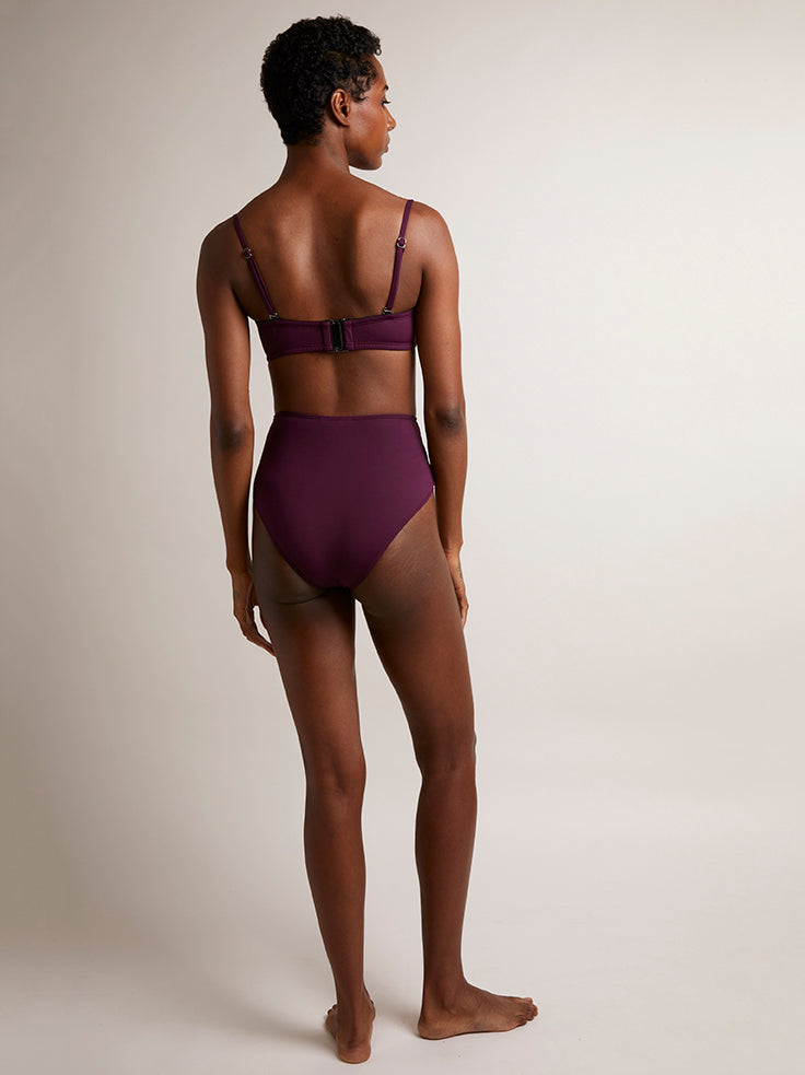 POSITANO in Wine - Inspired by 1960s vintage swimwear, this structured bikini top in navy is designed with a bandeau shape, removable straps and underwriting; offering additional lift and support. Also featuring the large signature PRISM gunmetal clasp at the centre back.