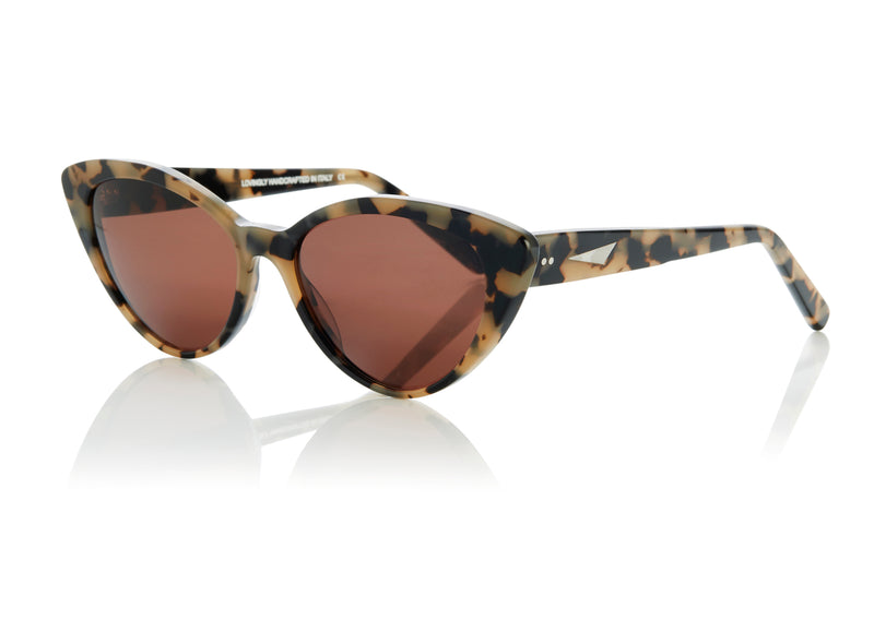 ACCRA - Empathy in cream tortoiseshell. A modern elegant take on the classic cat-eye with rounded edges and elongated tips. Lightweight medium to small sized style, suitable for all face shapes.