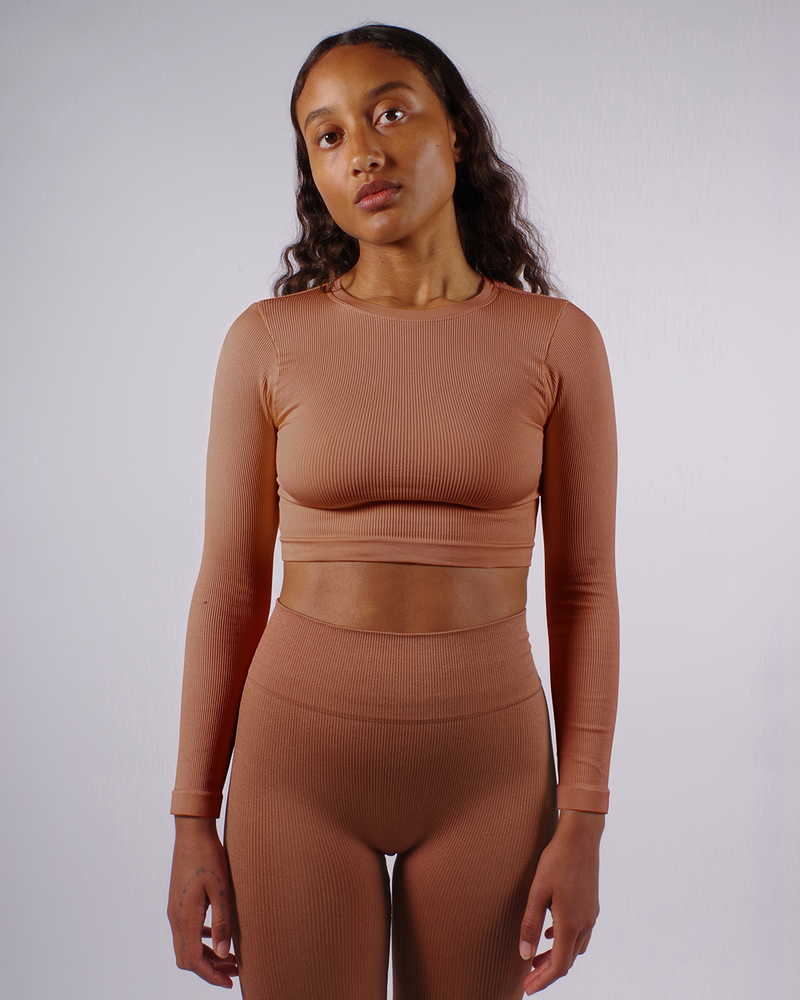 model wears ribbed awaken rusty pink high waisted leggings - prism2 london