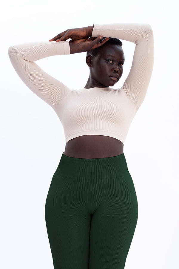 model wears awaken dark green gym compression leggings - prism2 london