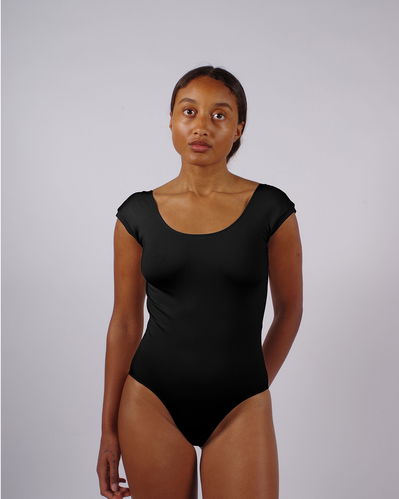 COMPASSIONATE - Black - Sleek one-piece suit, with high neck, cap sleeves, and low scoop open back. multi-function swimsuit and bodysuit.