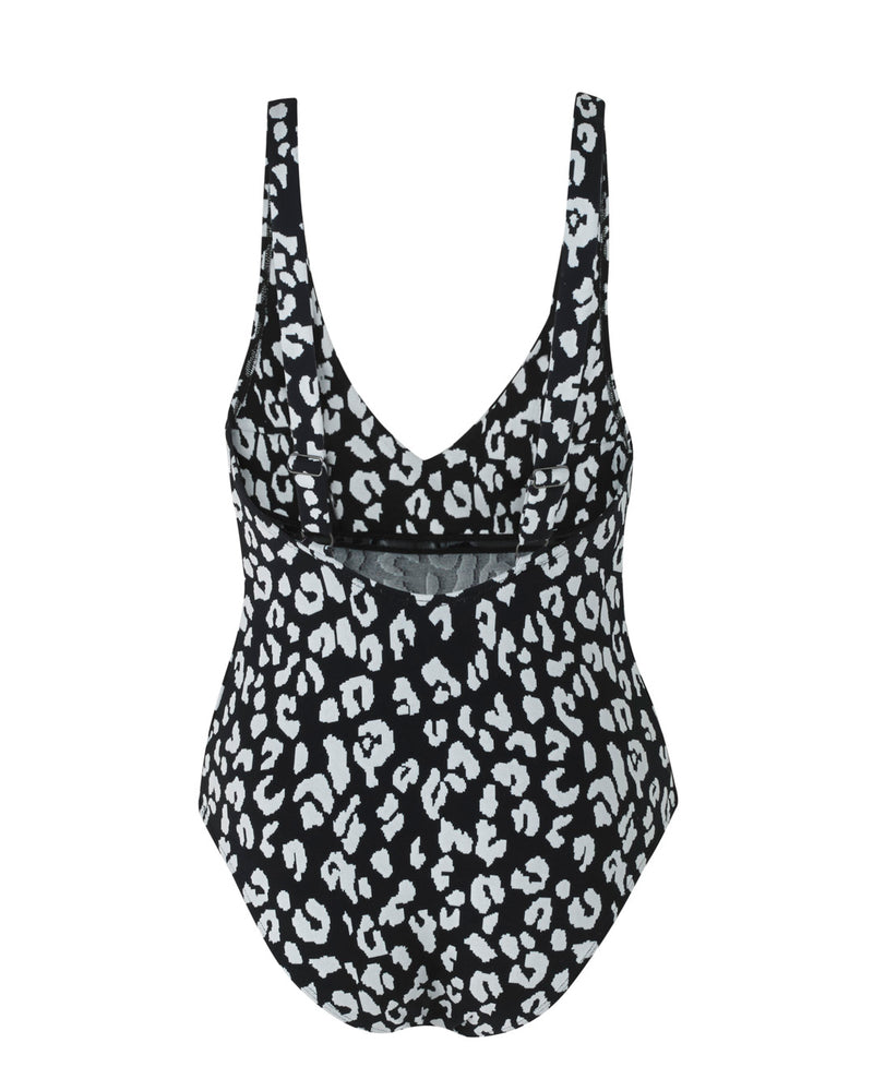 LIPARI - Black Leopard. This swimsuit with an adjustable back strap and v-neck, featuring a front tie knot to slim and flatter the silhouette.