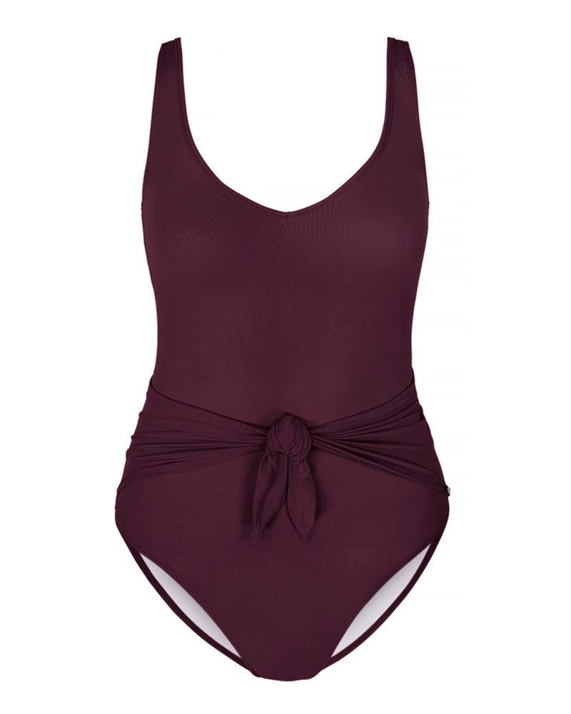 LIPARI - Wine. This swimsuit with an adjustable back strap and v-neck, featuring a front tie knot to slim and flatter the silhouette. 