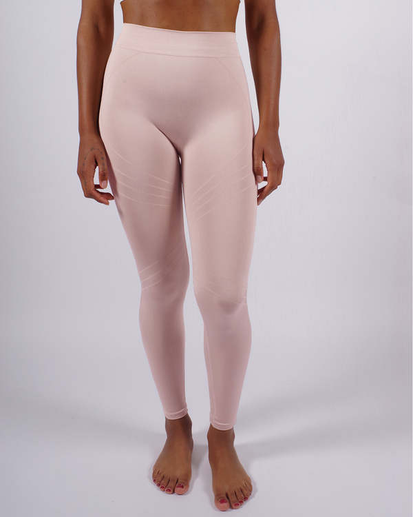 model wears Lucid leggings in blush - PRISM² - light pink leggings - Activewear leggings - Supportive - Shaping - Sculpting - Sustainable leggings - gym seamless leggings -  leggings for exercise - most flattering gym leggings