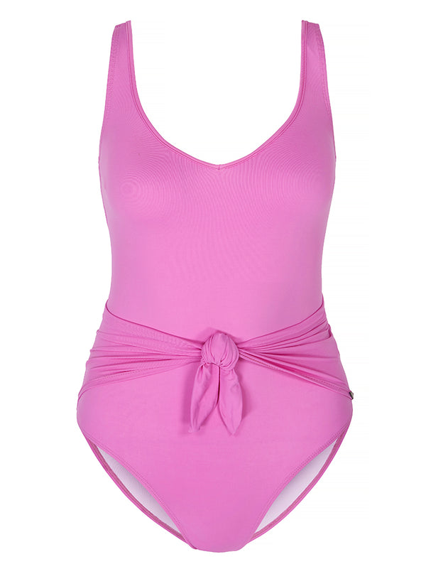 LIPARI - Magenta. Swimsuit with adjustable shoulder straps and v-neck featuring a tie front knot to slim the silhouette.