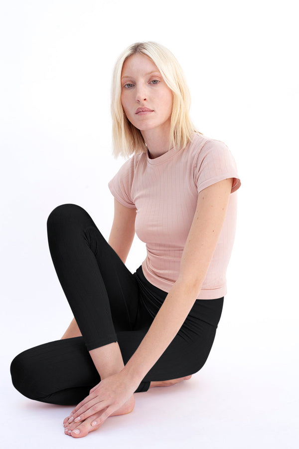 model wears supportive soft nourish leggings in black