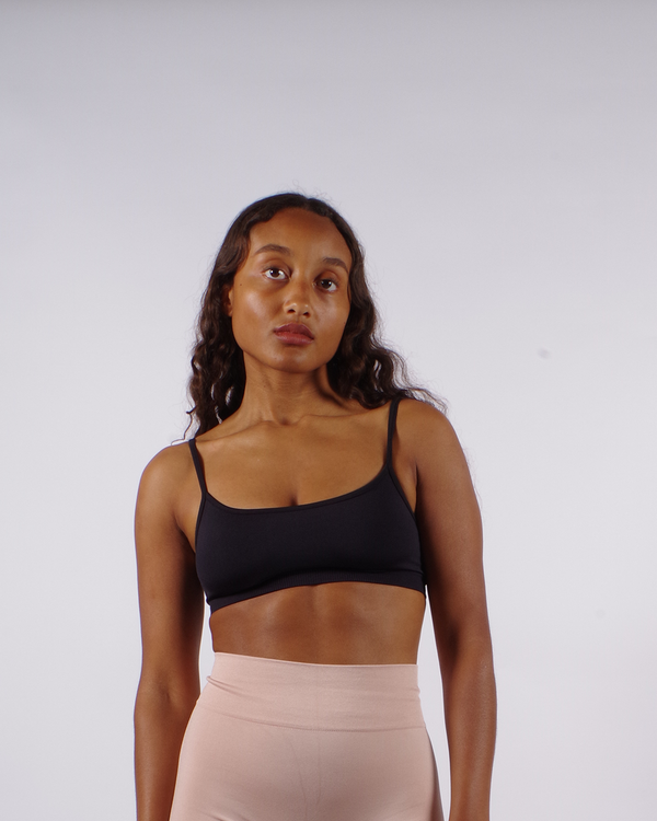 model wears seamless gym black bra top - prism2 london 