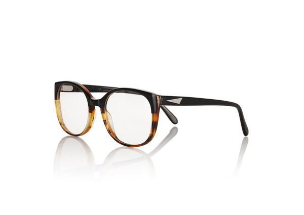 TOKYO Optical - Black & Amber Tortoiseshell. The frame is futuristic yet simple, lightweight medium to small style size - w/ rounded edges make it suitable for all face shapes.