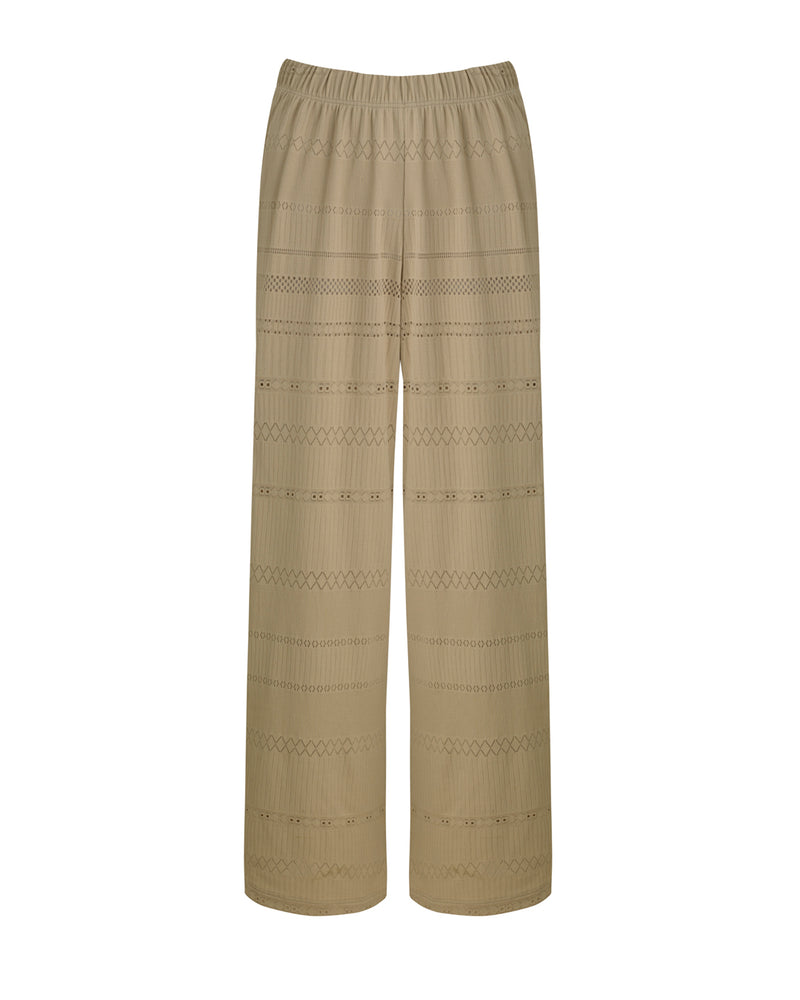 ATHENS - Sand. These are a pair of high-waisted trousers featuring a comfortable thick elastic waistband for easy everyday wear. The loose fit provides comfortability and easy wear, skimming the natural shape of the body with a slightly cropped leg.