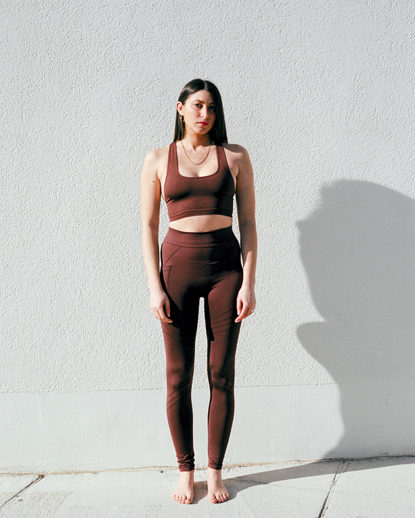 model wears vibrant leggings in maroon - leggings with a pocket - sculpting compression leggings - activewear leggings - supportive leggings - PRISM² - women curvy leggings - plus size leggings