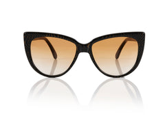 MOSCOW - Tiger Eye. Oversized cat-eye frames, arch above the brow and follow a curve that sits low on the cheek. Acetate exclusively developed for PRISM, handcrafted in Italy with Carl Zeiss, UV protected lenses.