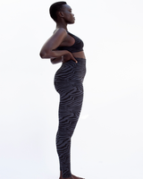 model wears Lucid leggings in Zebra Jacquard - PRISM² - gym seamless leggings -  leggings for exercise - most flattering gym leggings - Workout leggings for women - Gym leggings - Shaping - Sculpting - Sustainable leggings - Ethical leggings - Workout compression leggings 